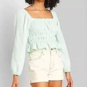 White Denim Shorts with tan stitching detail high rise , rolled cuff